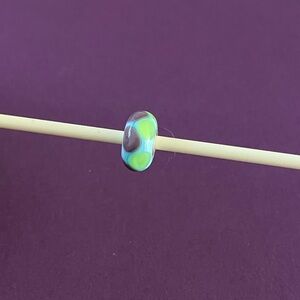 Trollbeads Retired green and purple triangles bead. TGLBE-10060.